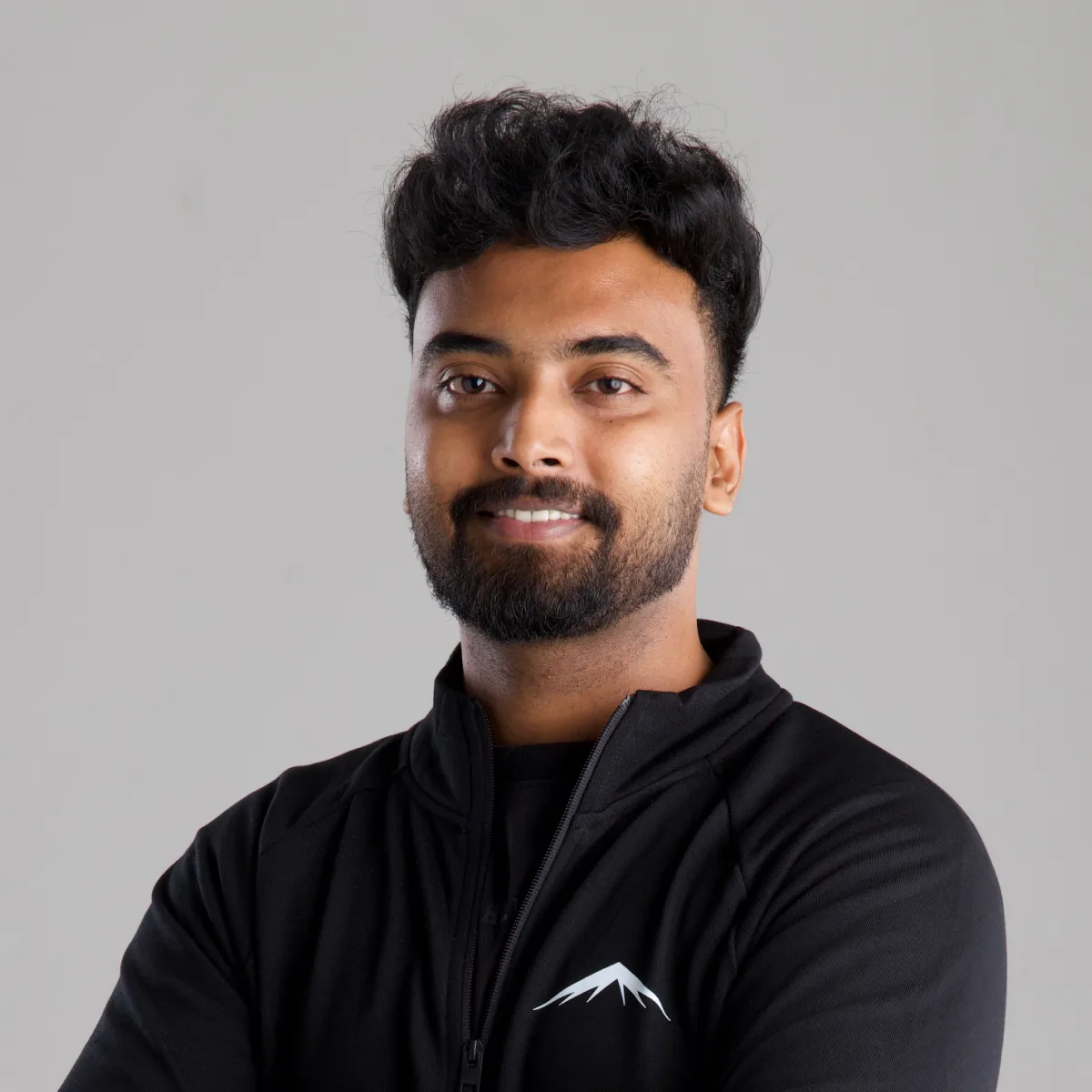 Akshay, smiling, in the Lumenridge jacket
