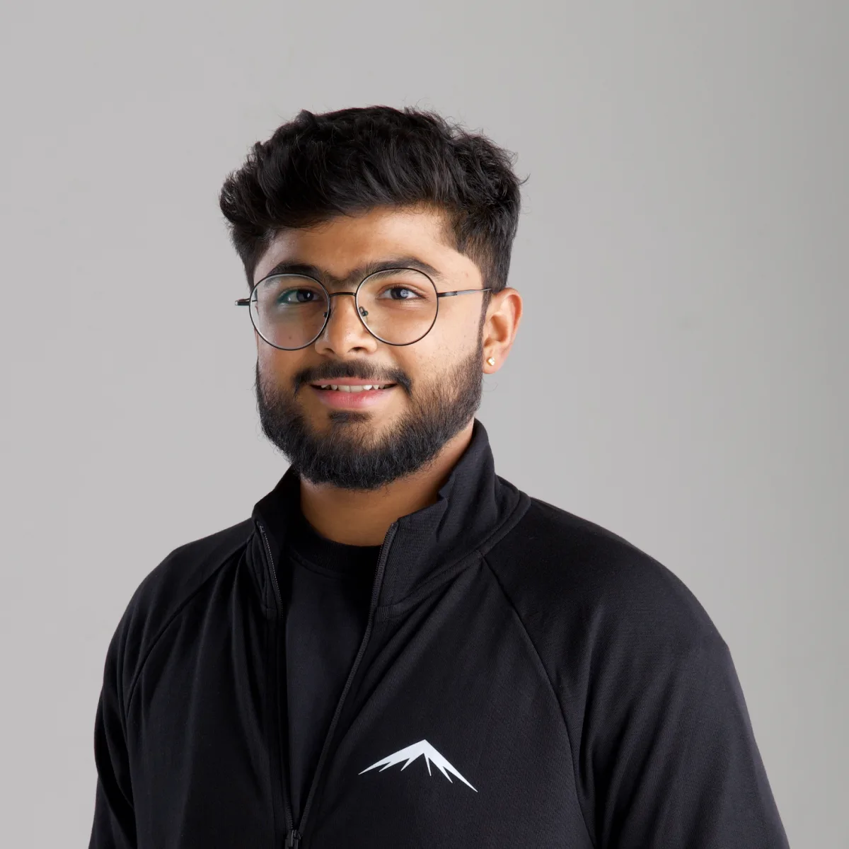 Viraj, smiling, in the Lumenridge jacket